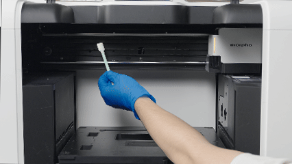 Applying lubricant to the groove of the X-axis beam